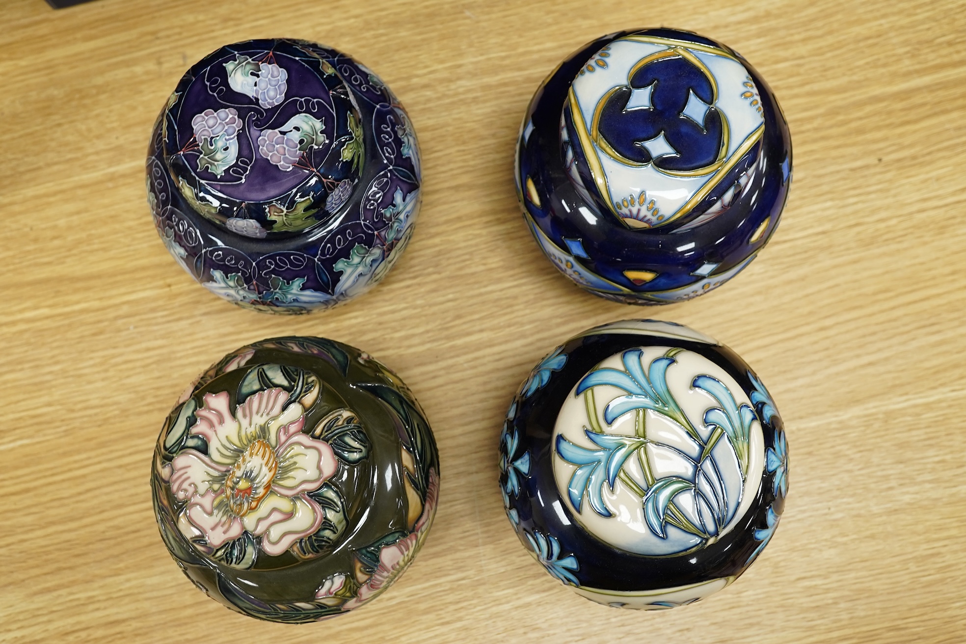 Four Moorcroft ginger jars and covers - ‘Midnight Blue’, ‘Inula’, ‘Sonans’ and ‘Gustav Augusta’ (4) 17cm high